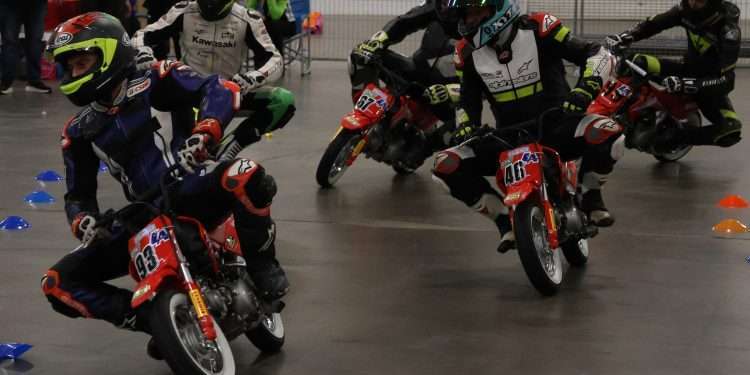 Saturday Mini Road racing Instructor Demonstration race for the Super Sonic Road Race School at the International Motorcycle SuperShow, and Bridgestone CSBK ace Tomas Casas leads the pack on spec Honda 50s from Kawasaki Superbike legend Jordan Szoke, CSBK twins racer Darin Marshall, Erik Tanasic and Lightweight front runner Jared Walker.